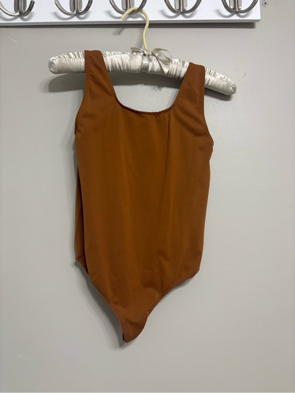 Skims soft smoothing thong bodysuit in copper. Women’s size medium